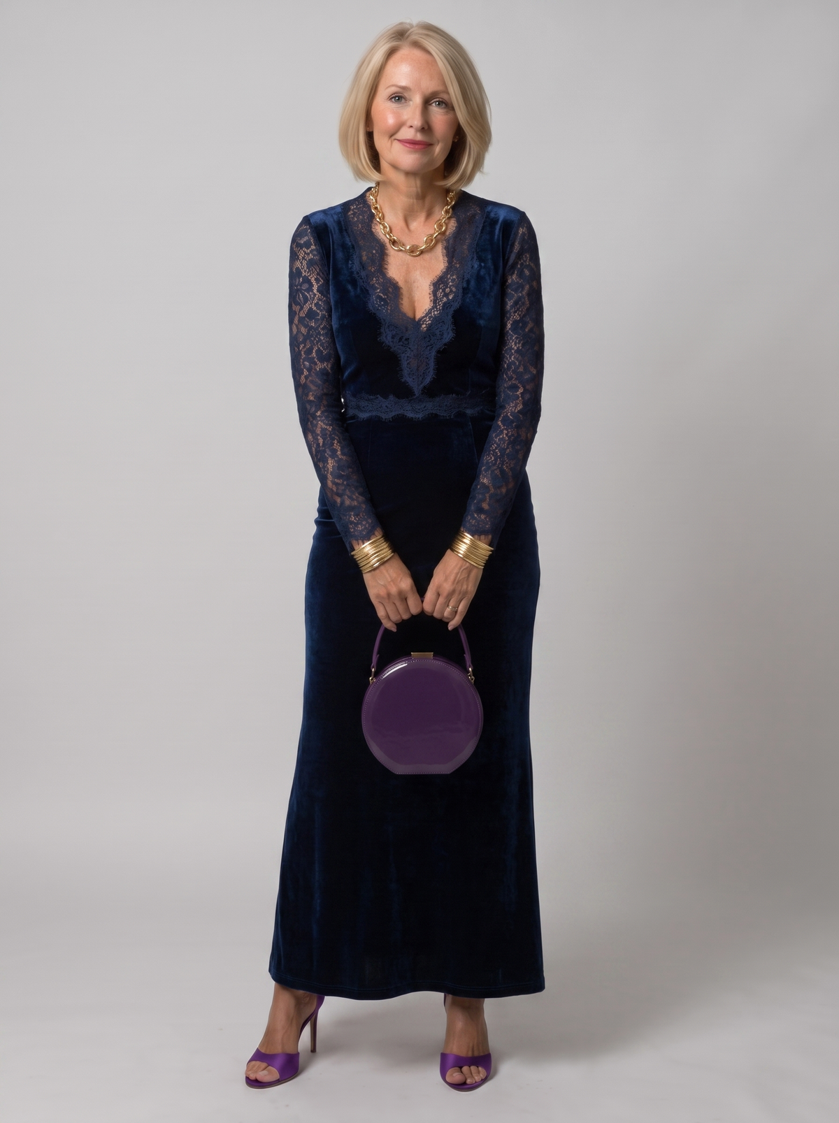 Ellie navy blue V-neck lace midi dress worn by model, studio photo