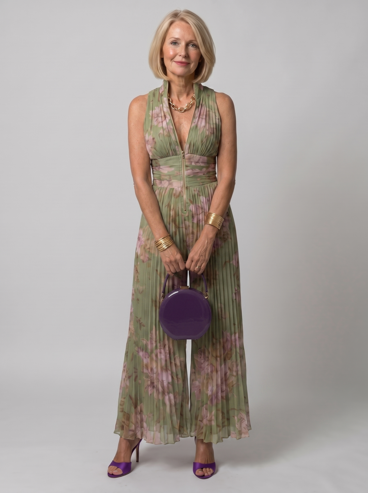 Zineb pleated floral jumpsuit worn by model, studio photo